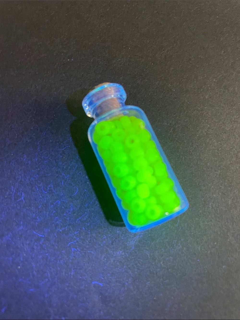Glass Vial with vintage uranium Green Beads Glow bright under UV light